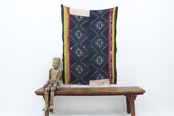 Vintage knitted blanket from vietnam with blue and black fabric 