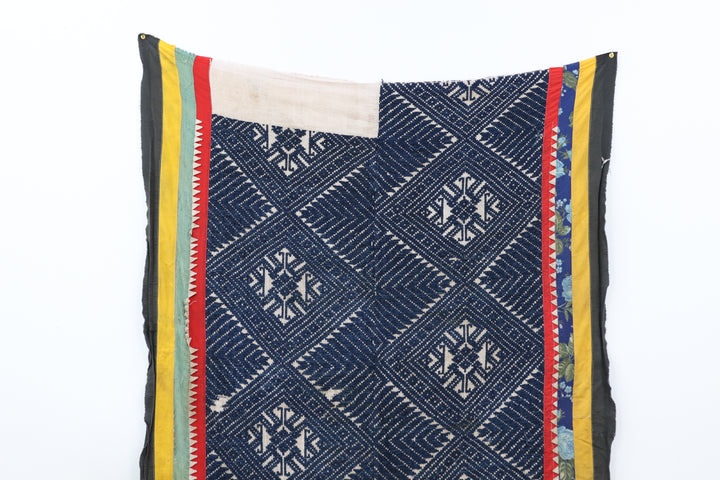 Vintage knitted blanket from vietnam with blue and black fabric 