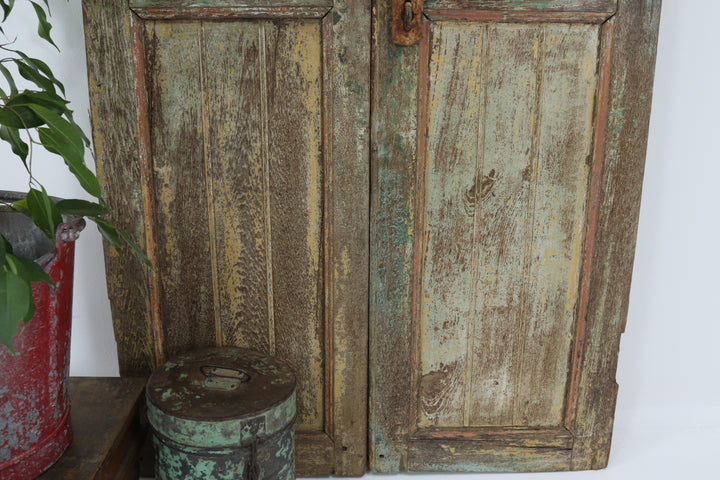 Vintage handmade 19th century indian doors in textured paintwork 
