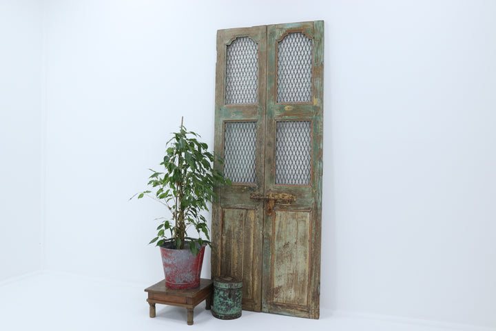 Vintage handmade 19th century indian doors in textured paintwork 
