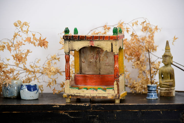 Vintage asian buddhist temple shrine with painted details 