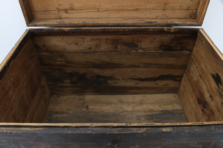Decorative wooden box with intricate carvings and a metallic clasp.