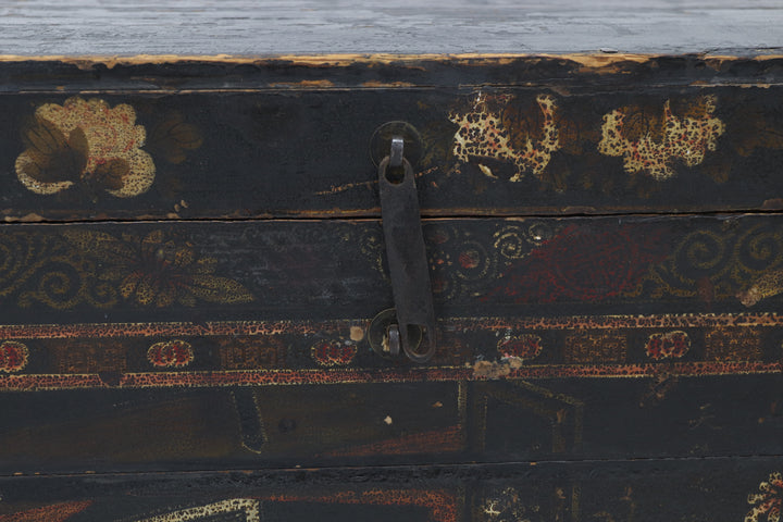 Decorative wooden box with intricate carvings and a metallic clasp.