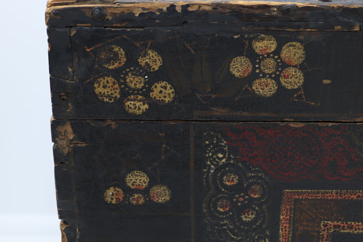 Decorative wooden box with intricate carvings and a metallic clasp.