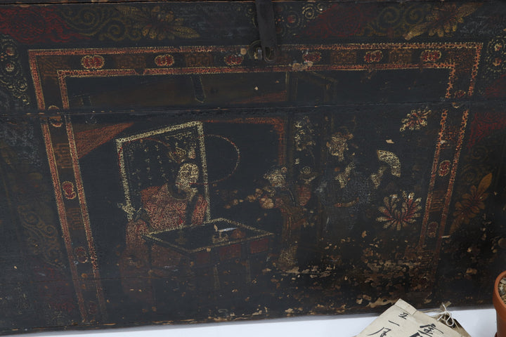 Decorative wooden box with intricate carvings and a metallic clasp.